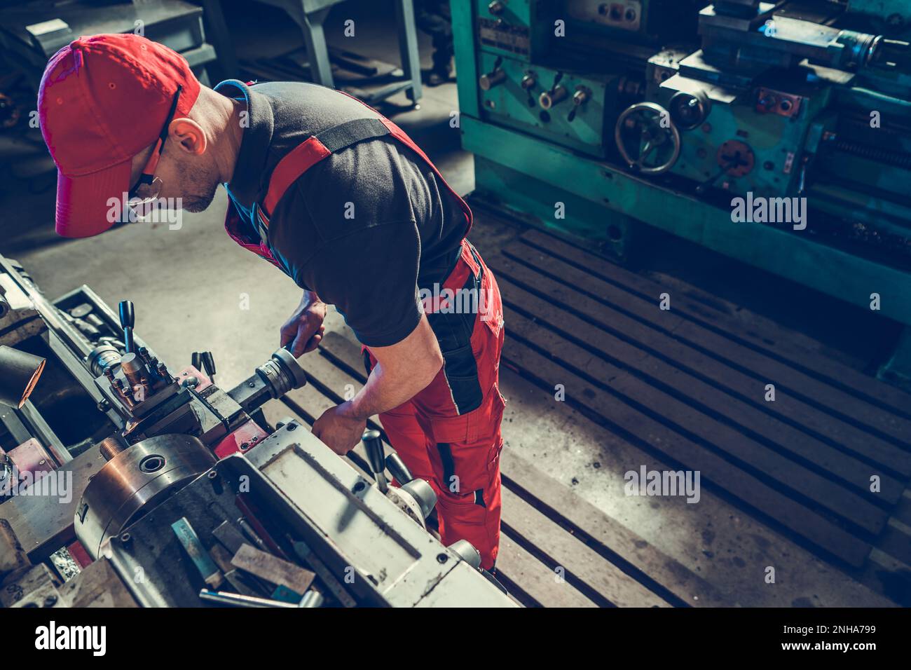 Professional Metal Worker Operating Lathe Machine. Custom Metal Elements Production. Stock Photo