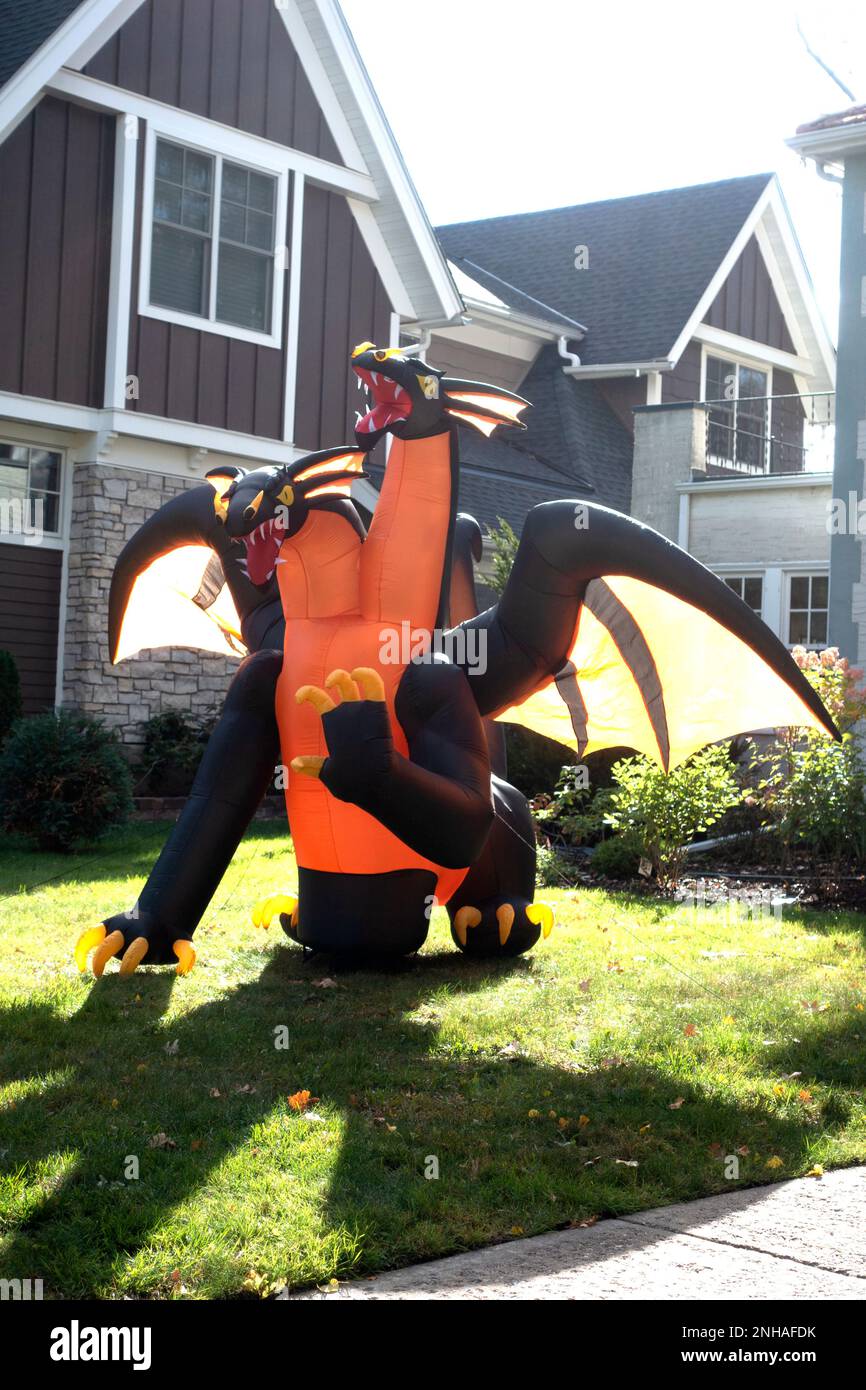 Halloween black and orange winged inflated two headed dragon stationed in someone's front yard. St Paul Minnesota MN USA Stock Photo