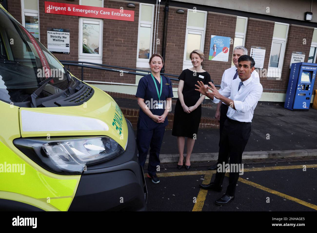 Britain's Prime Minister Rishi Sunak gestures in front of an ambulance