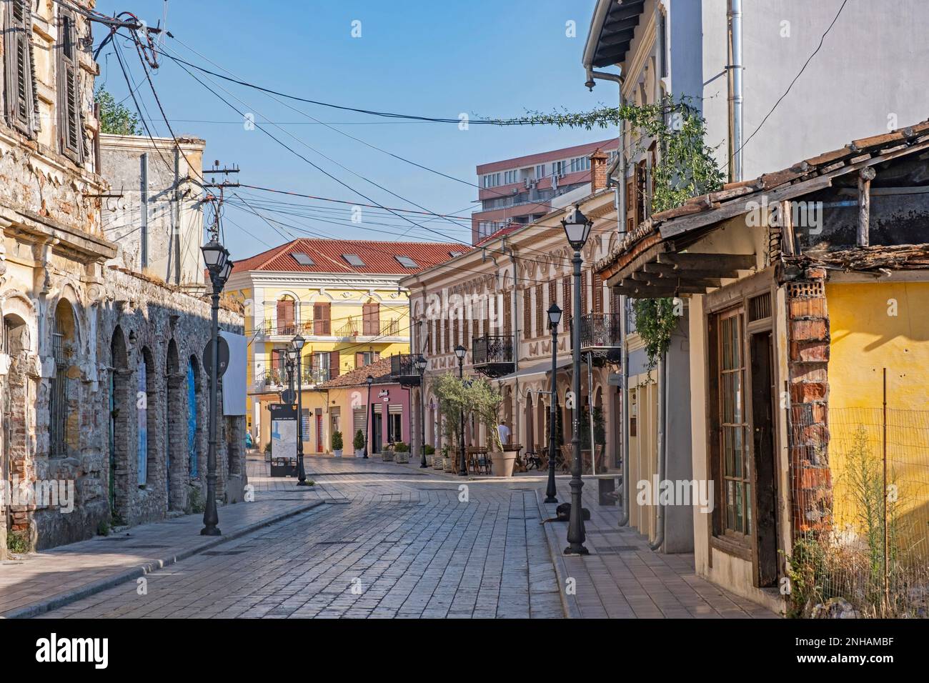 Street with colourful houses, shops and restaurants in the old city