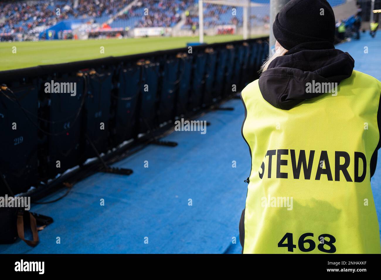 Steward next to the football pitch during match Stock Photo Alamy
