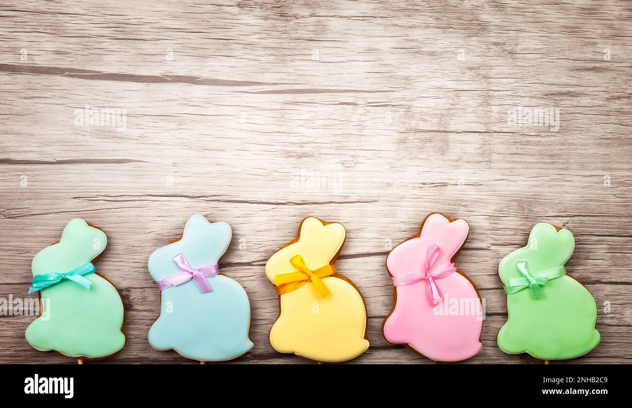 Easter composition with  easter cookies on wooden background. Easter concept with copy space. Flat lay, top view. Stock Photo
