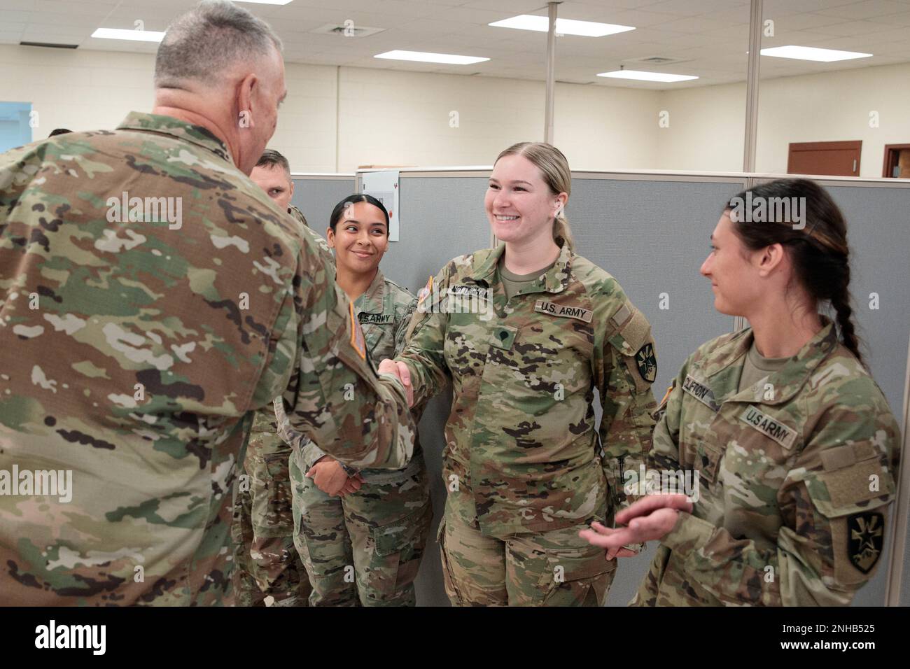 Arizona Army National Guard Brig. Gen. Lonnie J. Branum, land component commander, presents his coin to Spc. Emily Nottingham, a human resources specialist with the 198th RSG HHC, July 28, 2022, during his visit to Camp Shelby Joint Forces Training Center in Mississippi. Spc. Nottingham, who was at CSJFTC with her unit for  annual training, was recognized for her can do attitude and willingness to work outside her MOS during the mobilization exercise Pershing Strike 2022. (Arizona Army National Guard photo by Sgt. 1st Brian A. Barbour) Stock Photo