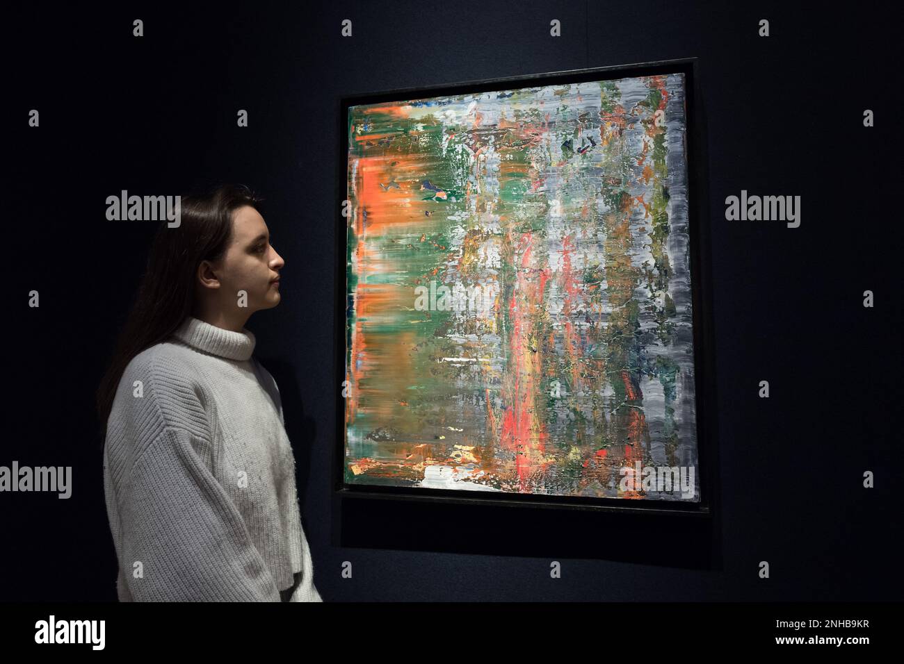 London, UK. 21st Feb, 2023. LONDON, UNITED KINGDOM - FEBRUARY 21, 2023: A staff member looks at a painting titled 'Abstraktes Bild (704-2)' by Gerhard Richter, estimate: £2,500,000-3,500,000 during a photo call for the upcoming 20th/21st Century Evening Sale and The Art of the Surreal Evening Sale in London, United Kingdom on February 21, 2023. (Photo by WIktor Szymanowicz/NurPhoto) Credit: NurPhoto SRL/Alamy Live News Stock Photo