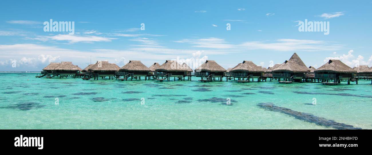 Luxury overwater bungalows in lagoon of Moorea Island, French Polynesia. Stock Photo