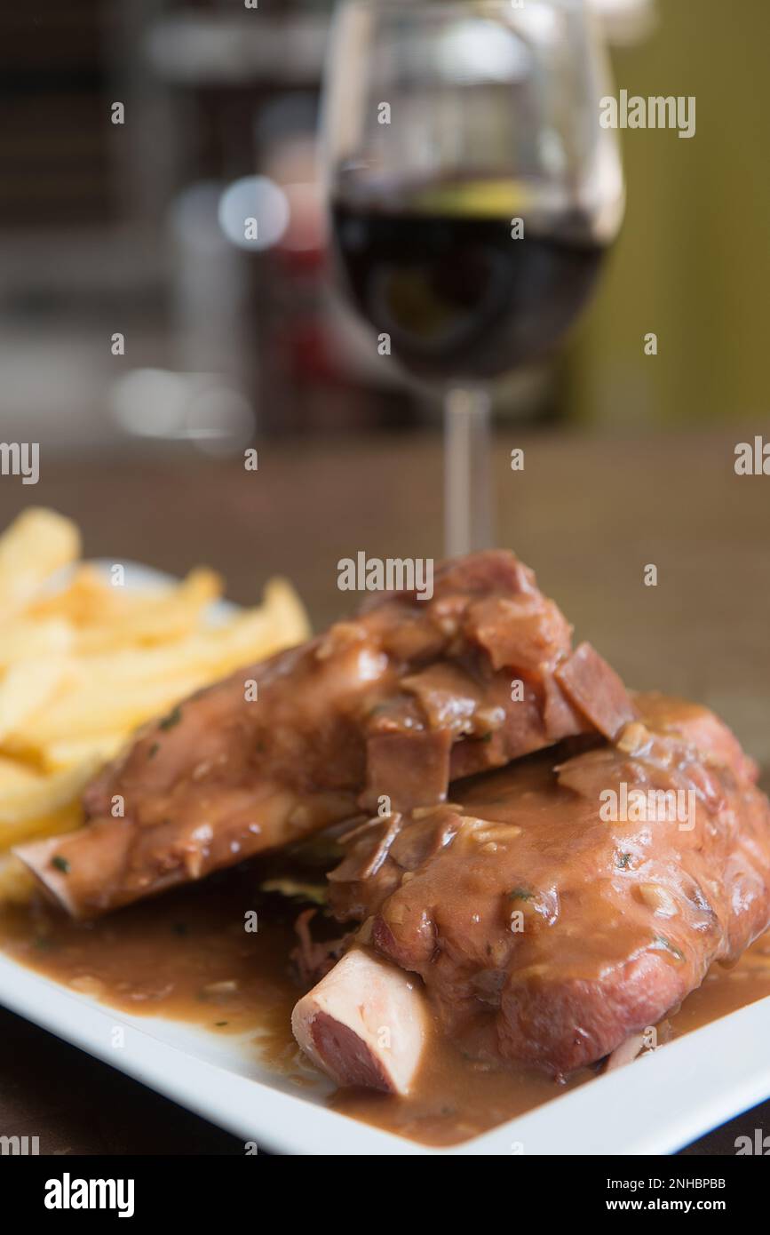 delicious beef knuckle with a glass of wine Stock Photo