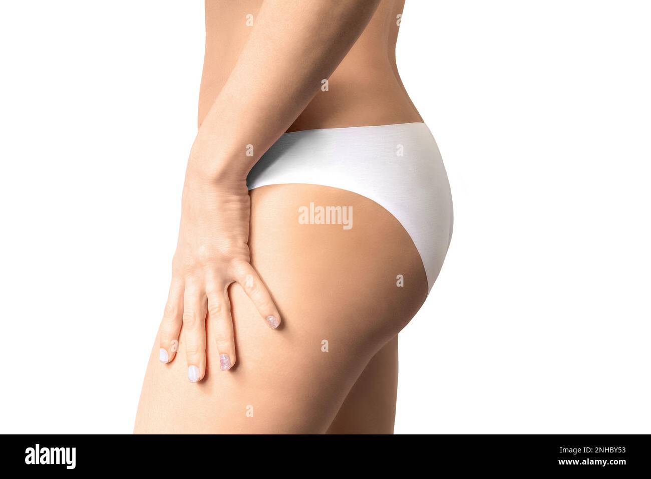 Side view of woman dressed in white panties. Stock Photo
