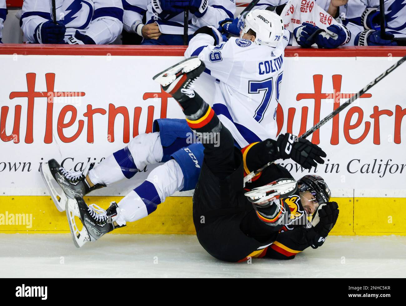 Tampa Bay Lightning forward Ross Colton, left, checks Calgary Flames
