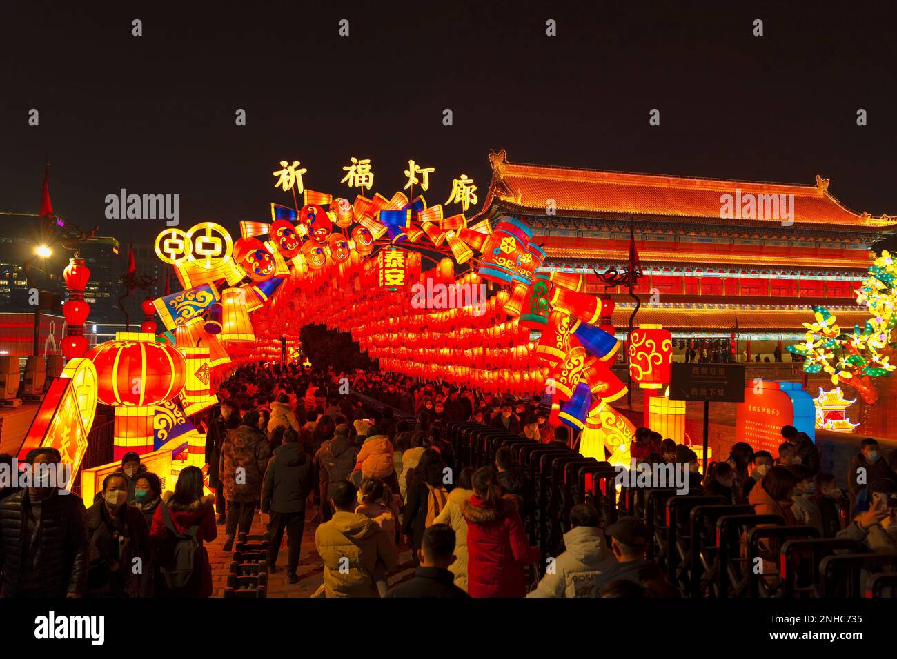 People tour a lantern show on the ancient city wall in Xi'an in ...