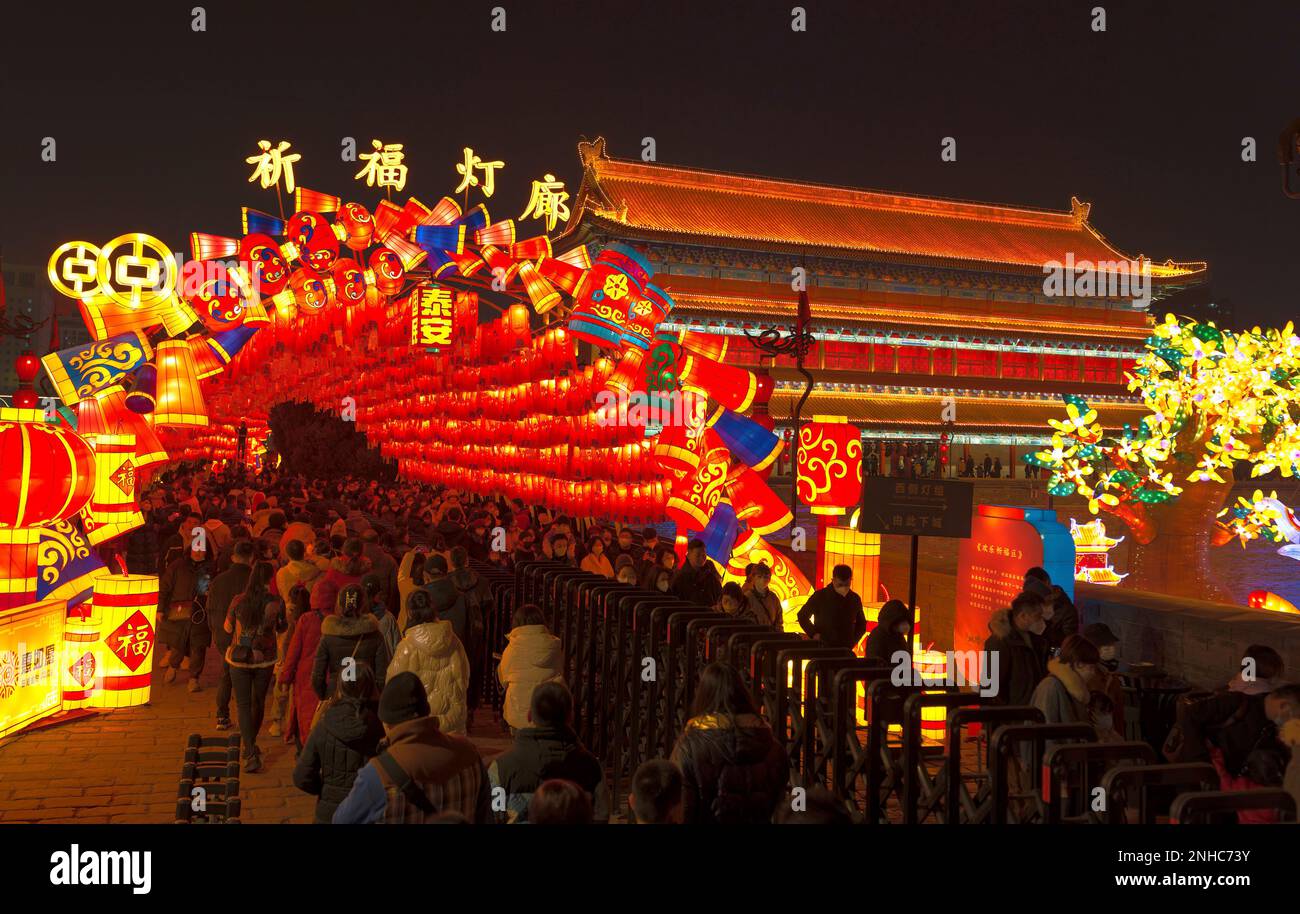 People tour a lantern show on the ancient city wall in Xi'an in ...