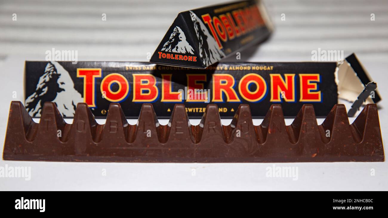 Traditional dark toblerone chocolate isolated in selective focus Stock