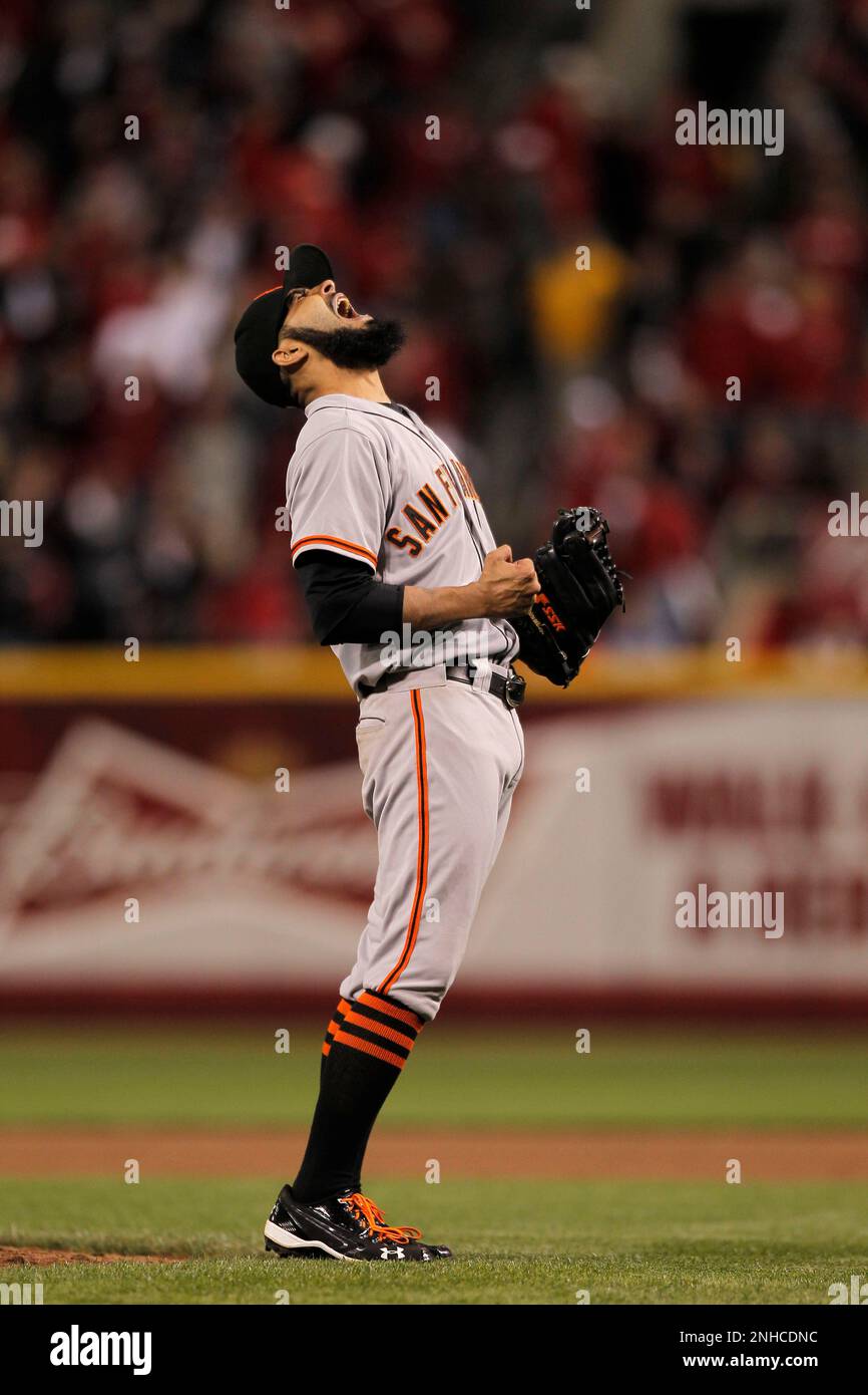 Giants' closing pitcher Sergio Romo lets out a scream as he make