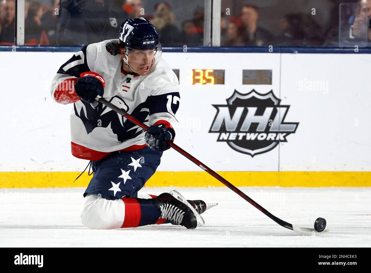 Washington Capitals' Dylan Strome (17) passes the puck against the