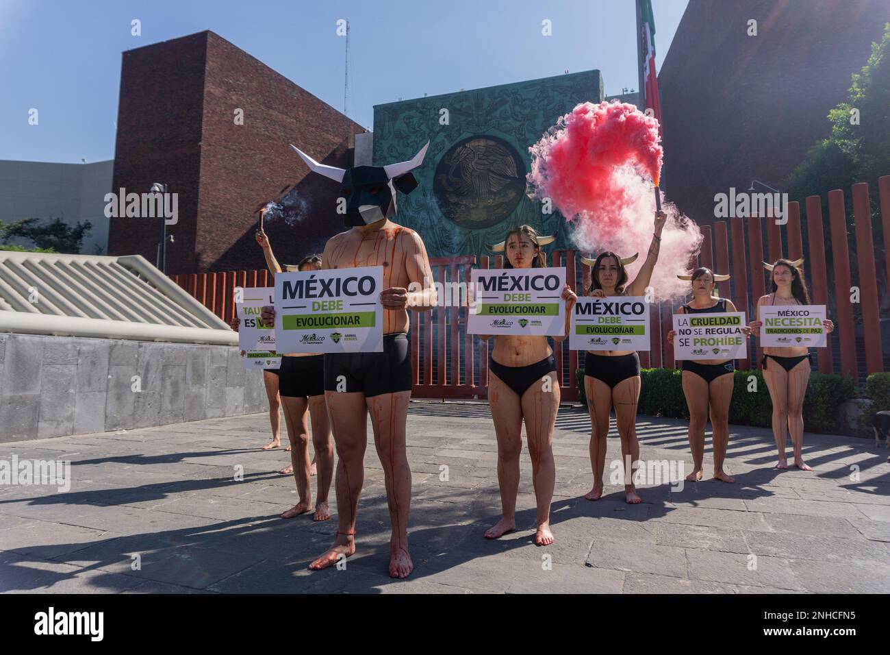 Mexico City, Mexico. February 21, 2023. Mexico City, Mexico: .Members of the ''Animal Heroes'' collective, peacefully protested outside of the chamber of represetatives in San LÃ¡zaro, some of the members of this collective painted their bodies with red paint to simulate blood and used horns and masks to ask the federal deputies to dictaminate about the legislative proposal they made to the enviroment commision about bull torture in bullfighting events. Credit: ZUMA Press, Inc./Alamy Live News Stock Photo