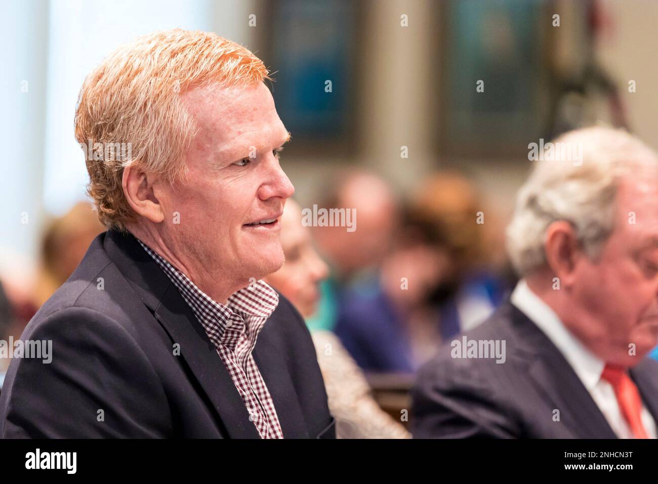 Alex Murdaugh smiles while listening to his son Buster Murdaugh testify during his trial at the