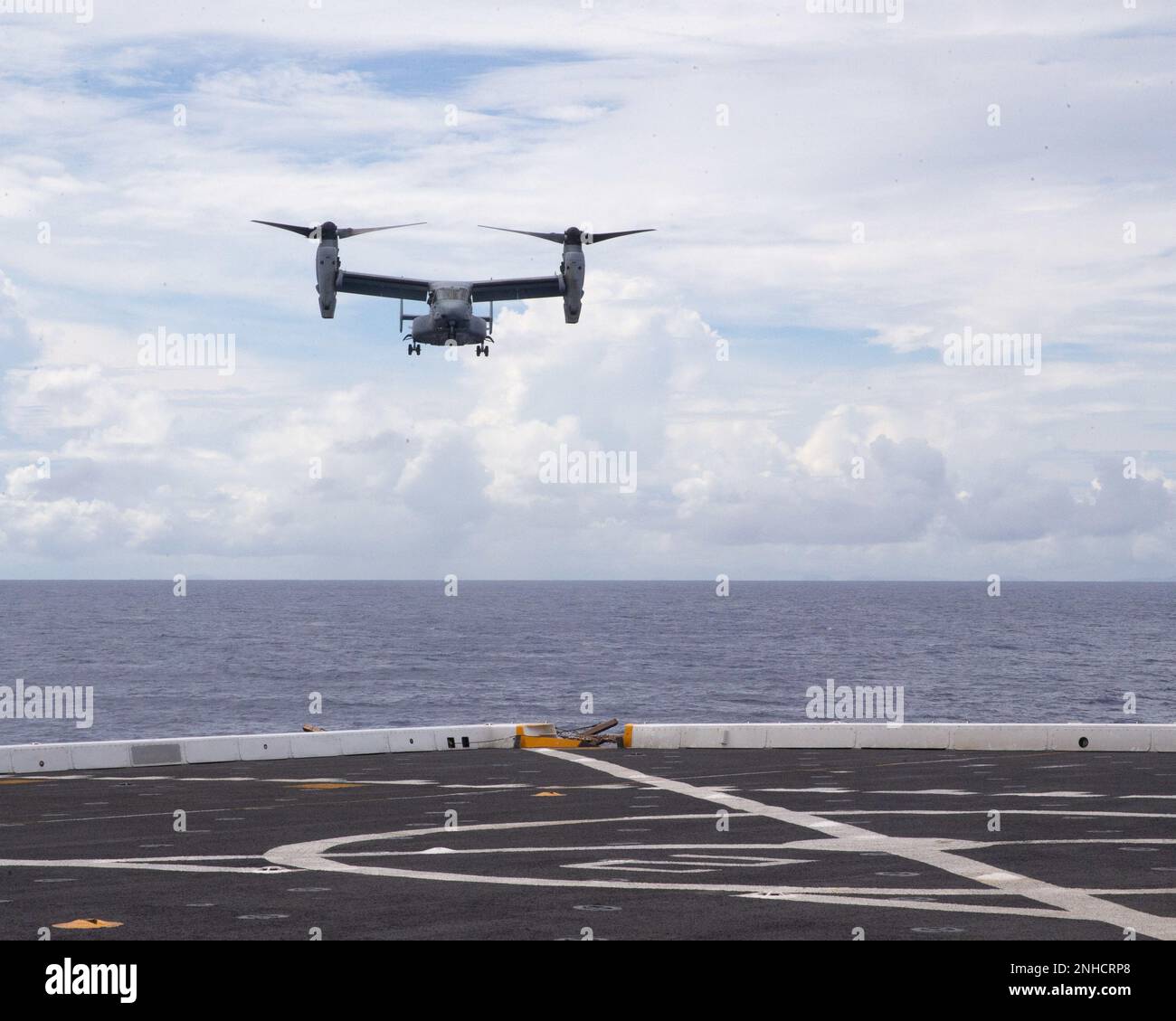A U.S. Marine Corps MV-22B Osprey prepares to land aboard USS New Orleans (LPD 18), in the Philippine Sea, July 28, 2022. The 31st MEU, the Marine Corps’ only continuously forward-deployed MEU, provides a flexible and lethal force ready to perform a wide range of military operations as the premiere crisis response force in the Indo-Pacific region. Stock Photo