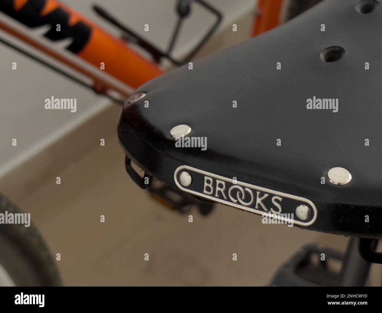 a beautiful black leather vintage Brooks bicycle saddle, detail shot Stock Photo