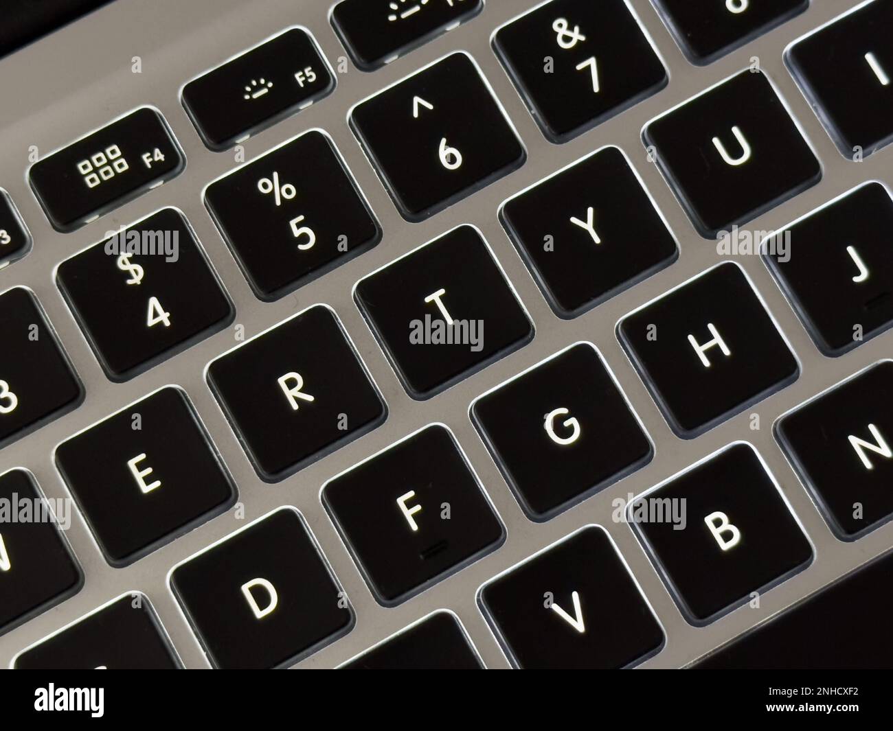an illuminated keyboard, of an Apple mabbbok air, detail, close up Stock Photo