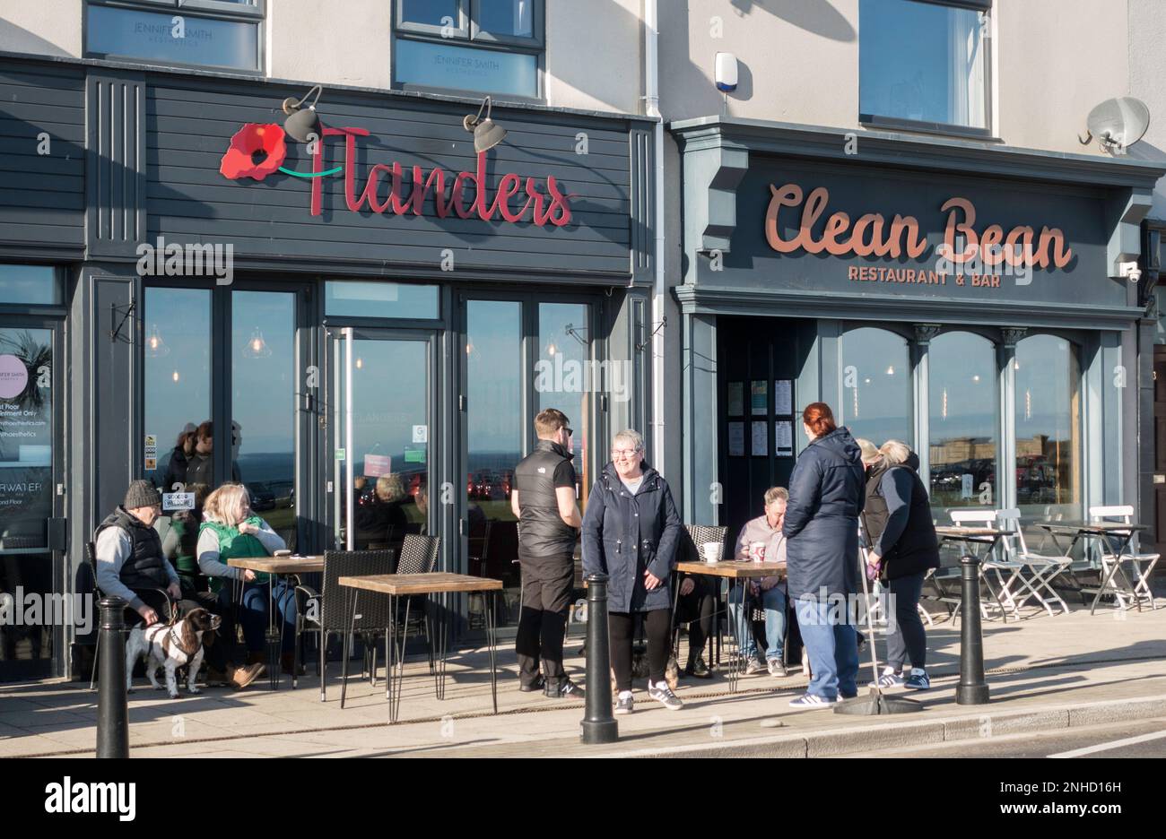 People sitting outside a café on Seaham seafront  in Co. Durham, England, UK Stock Photo