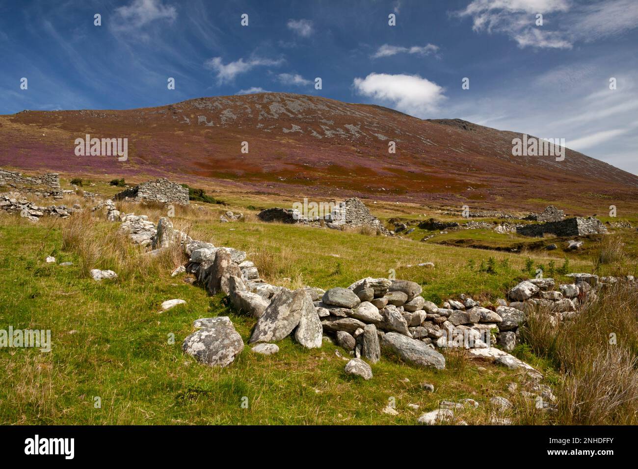 Deserted village and mountain valley under Slievemore mountain on Achill island on the Wild Atlantic Way in County Mayo in Ireland Stock Photo