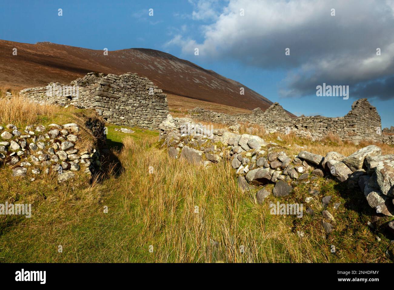 Deserted village and mountain valley under Slievemore mountain on Achill island on the Wild Atlantic Way in County Mayo in Ireland Stock Photo
