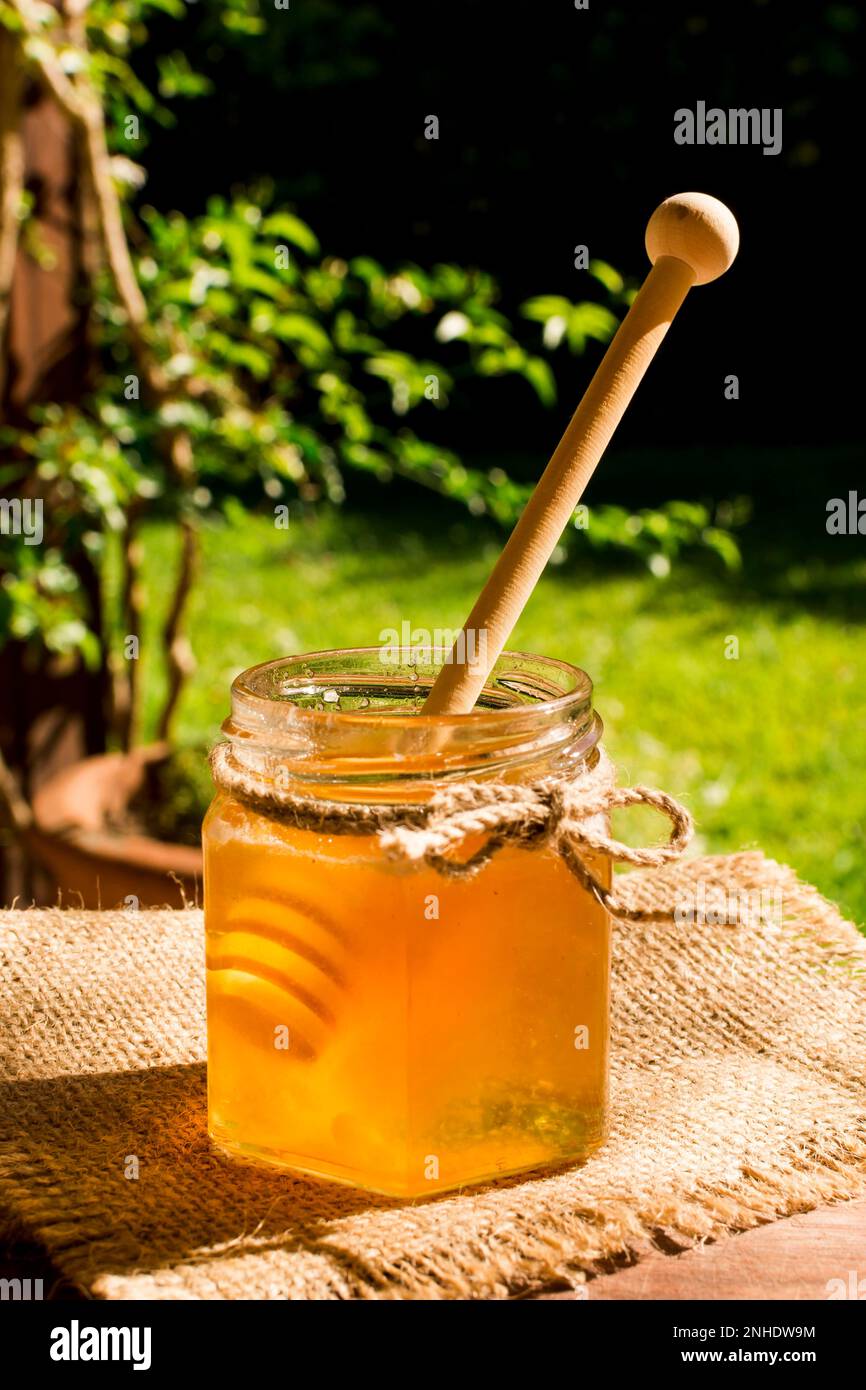 honey jar with spoon. Beautiful photo Stock Photo Alamy