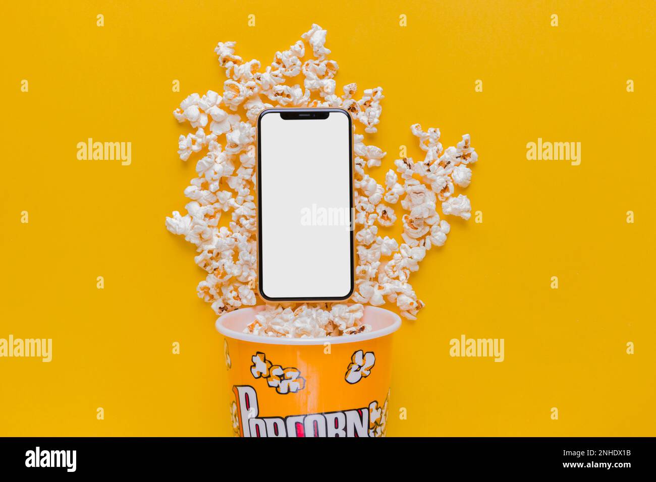 popcorn box with mobile phone Stock Photo Alamy