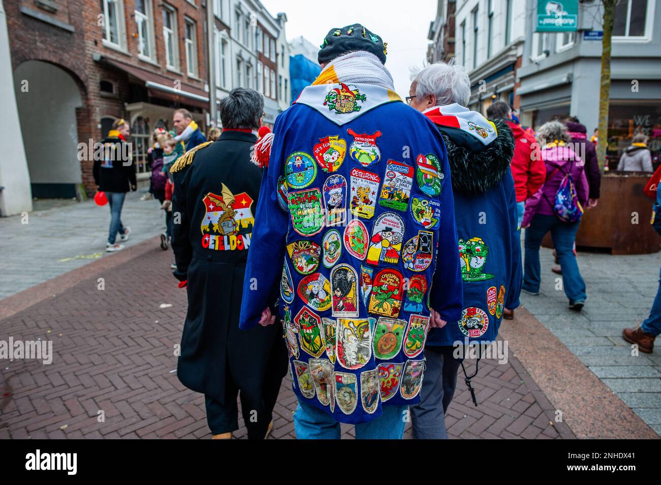 Den Bosch, Netherlands. 20th Feb, 2023. A man seen wearing the traditional  blue farmer's smock full of emblems during the parade. The city of Den  Bosch, Netherlands, comes alive each year during