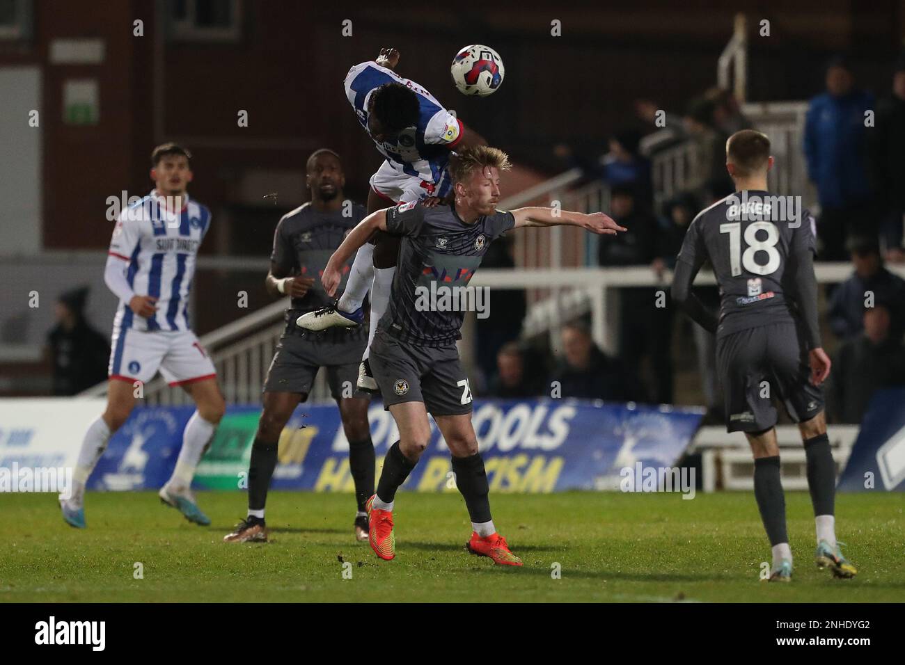 Mouhamed Niang of Hartlepool United chah Newport County's Harry Charsley during the Sky Bet League 2 match between Hartlepool United and Newport County at Victoria Park, Hartlepool on Tuesday 21st February 2023. (Photo: Mark Fletcher | MI News) Credit: MI News & Sport /Alamy Live News Stock Photo