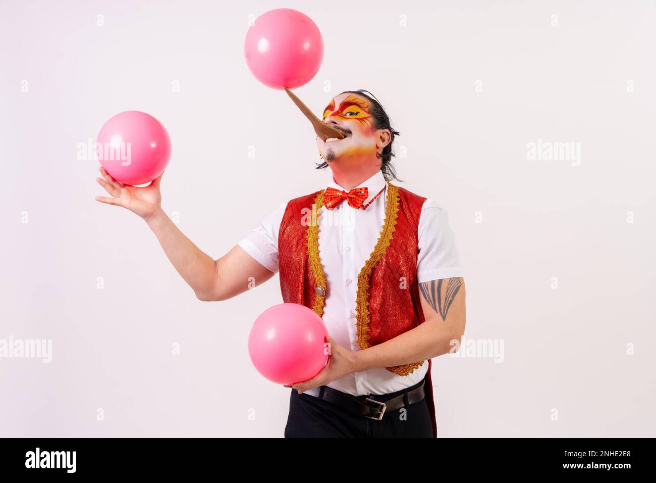 Smiling juggler juggling balls isolated on white background Stock Photo Alamy