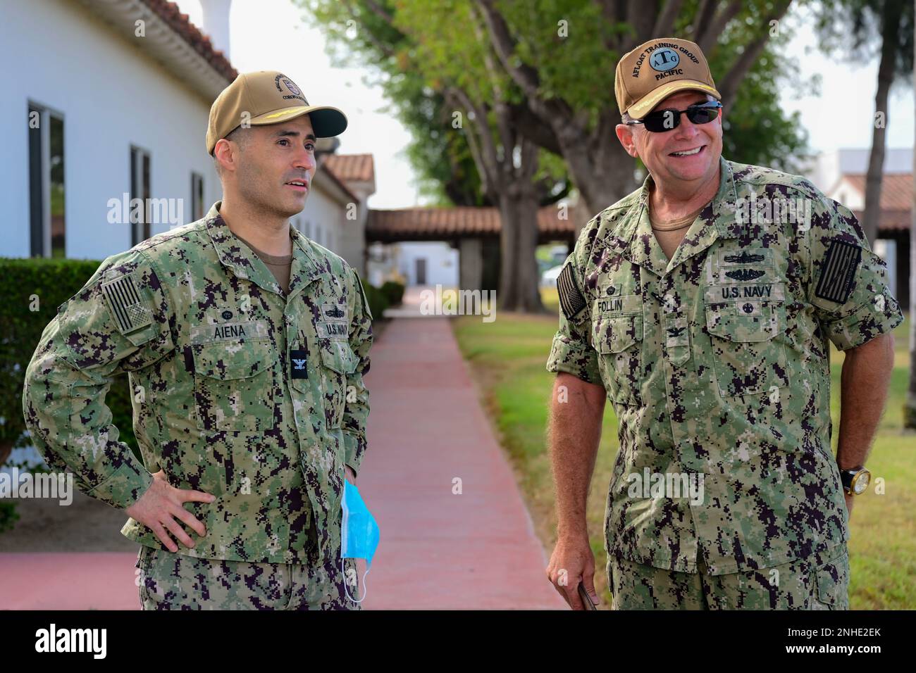 U.S. Navy Capt. Mike Aiena, commanding officer of Naval Surface Warfare Center, Corona Division, and Capt. Christopher Follin, commodore of Afloat Training Group Pacific, speak during a tour of the warfare center in Norco, California, July 28, 2022. As part of his visit to the warfare center, Follin was given an overview of the command and its role in Live, Virtual, Constructive training exercises. Stock Photo