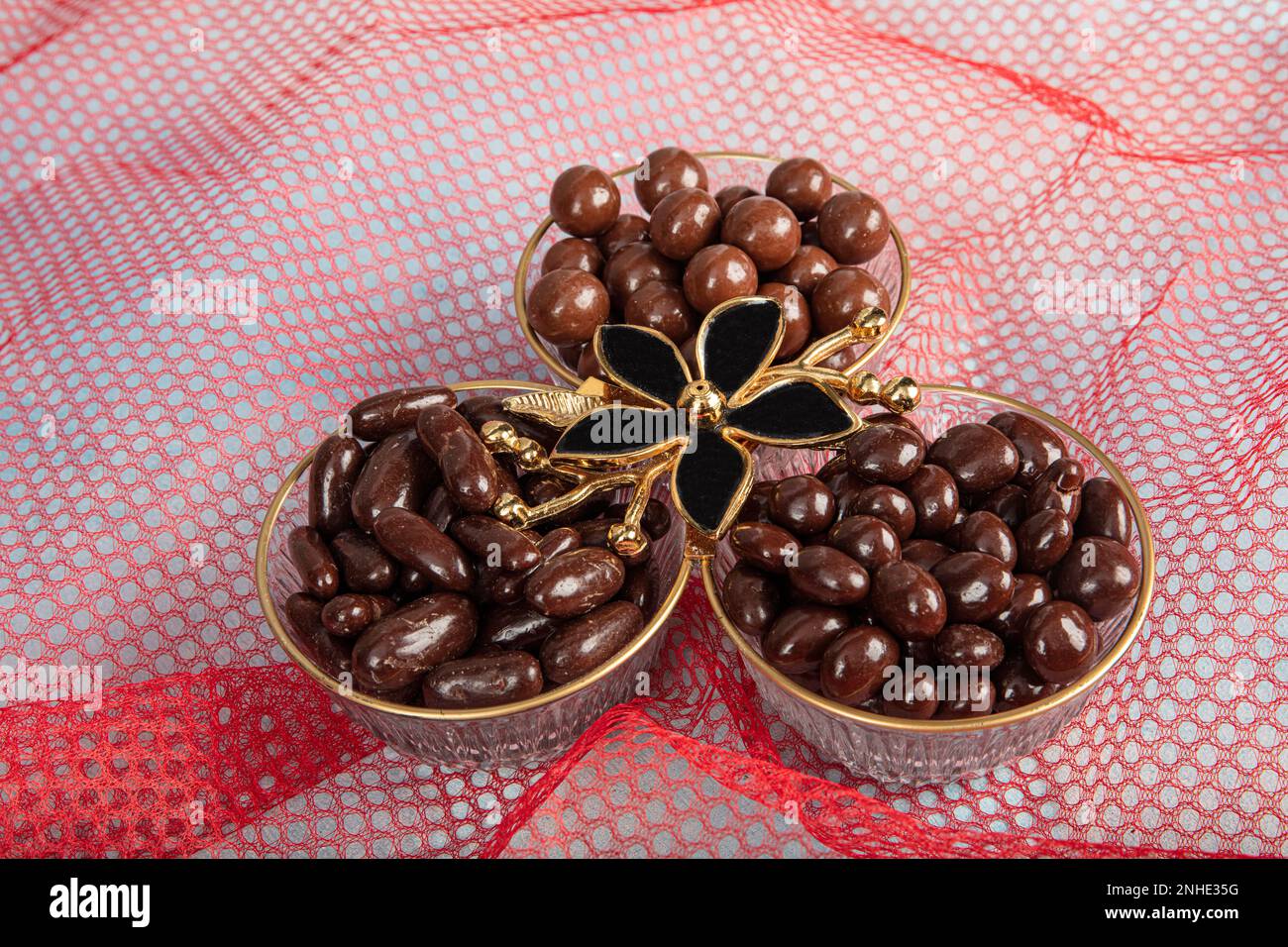 Chocolate dragee in luxury candy cane.chocolate glazed almonds