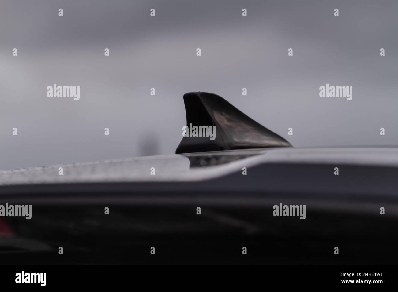 Modern car radio antenna. Shark fin antenna. Modern car roof Stock