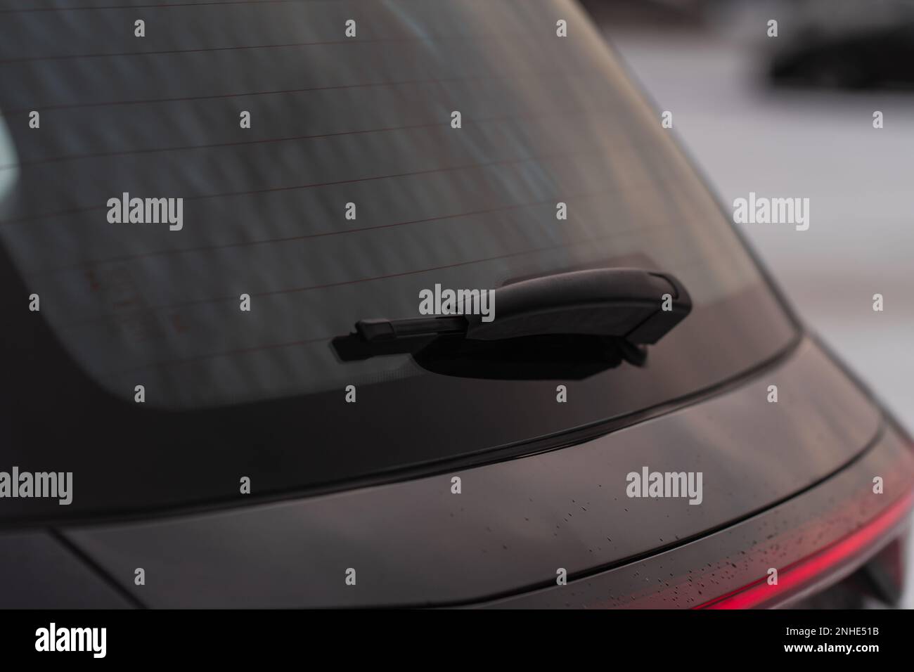 Car rear window. A car wiper cleans the rear window Stock Photo Alamy
