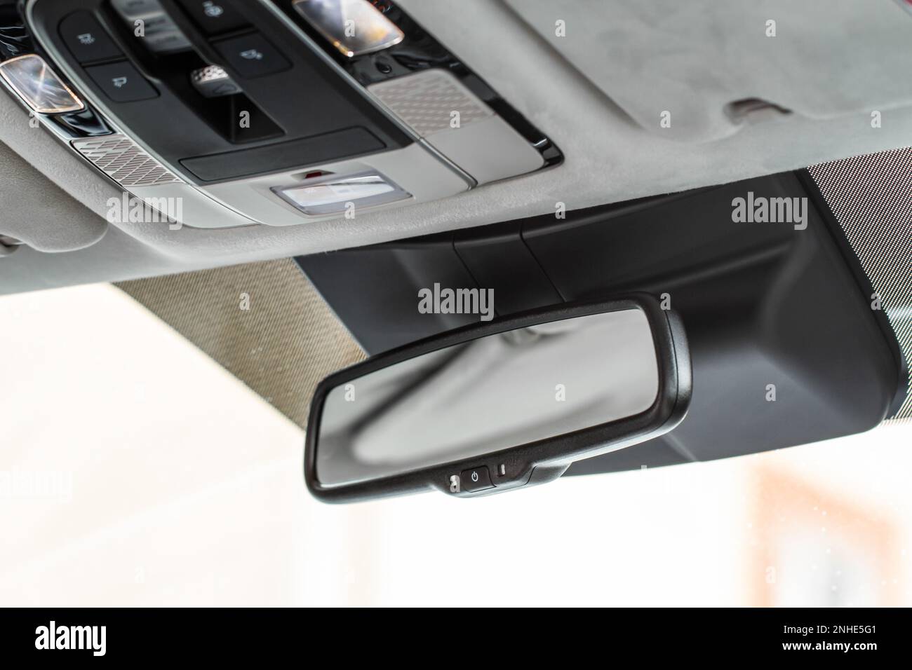 Rear view mirror closeup in nodern car. Car rear view mirror inside the ...