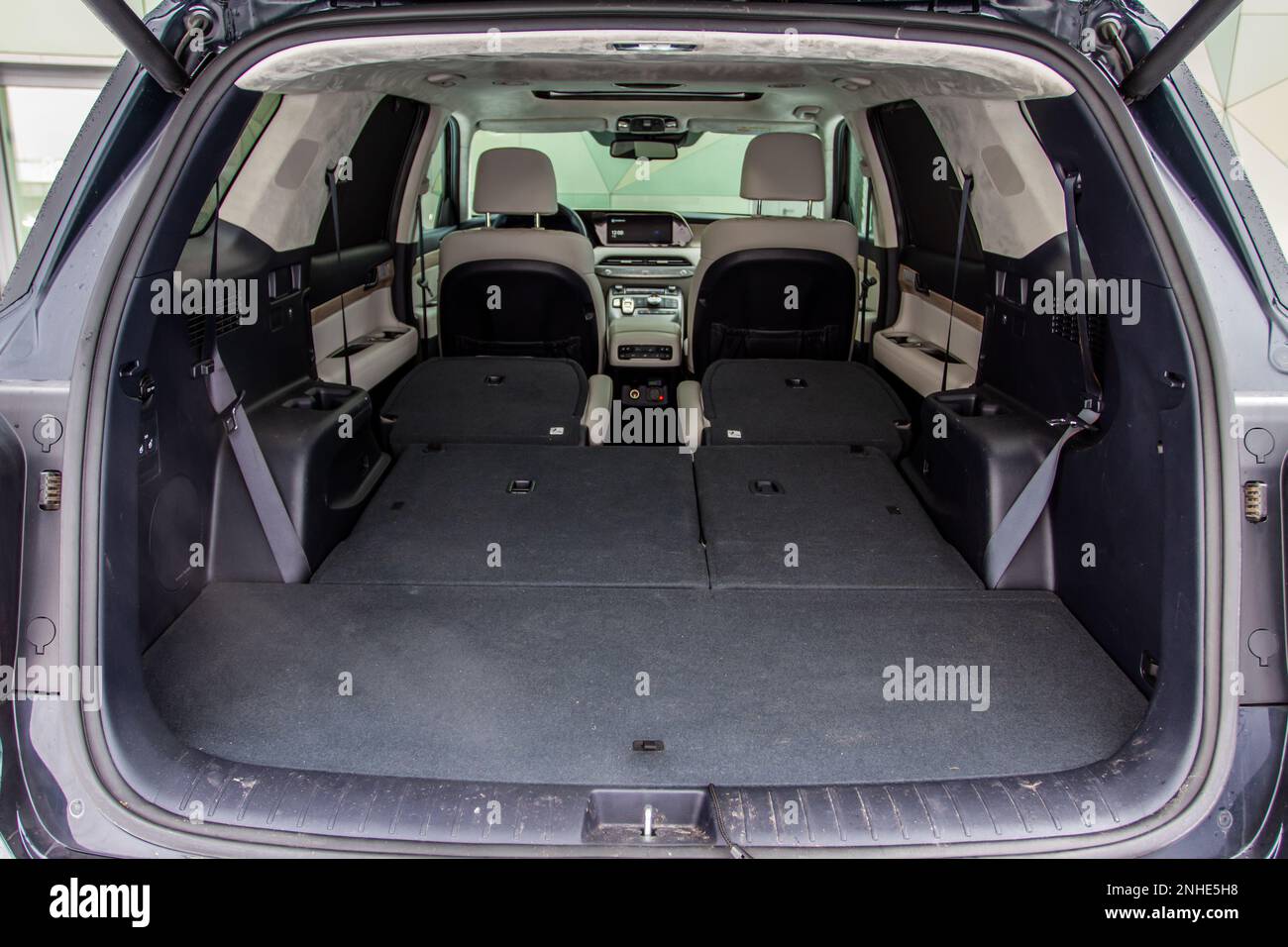 Huge, clean and empty car trunk in interior of compact suv. Rear view
