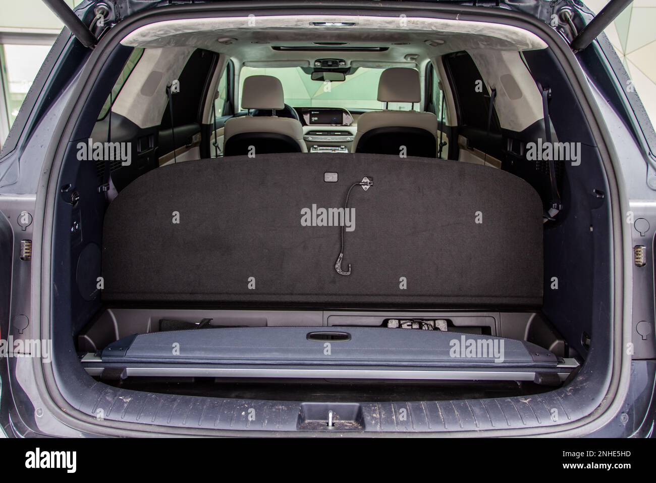 View of the rear storage area in a SUV car. Clean, open empty trunk