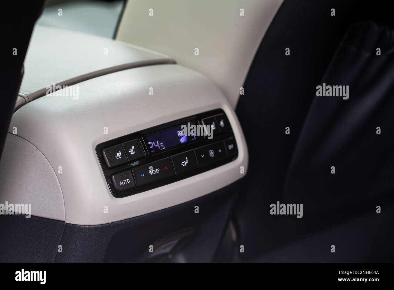 Modern car. Digital second row seat temperature control. Car air conditioning system button. Automatic climate control system. Fan speed and temperatu Stock Photo