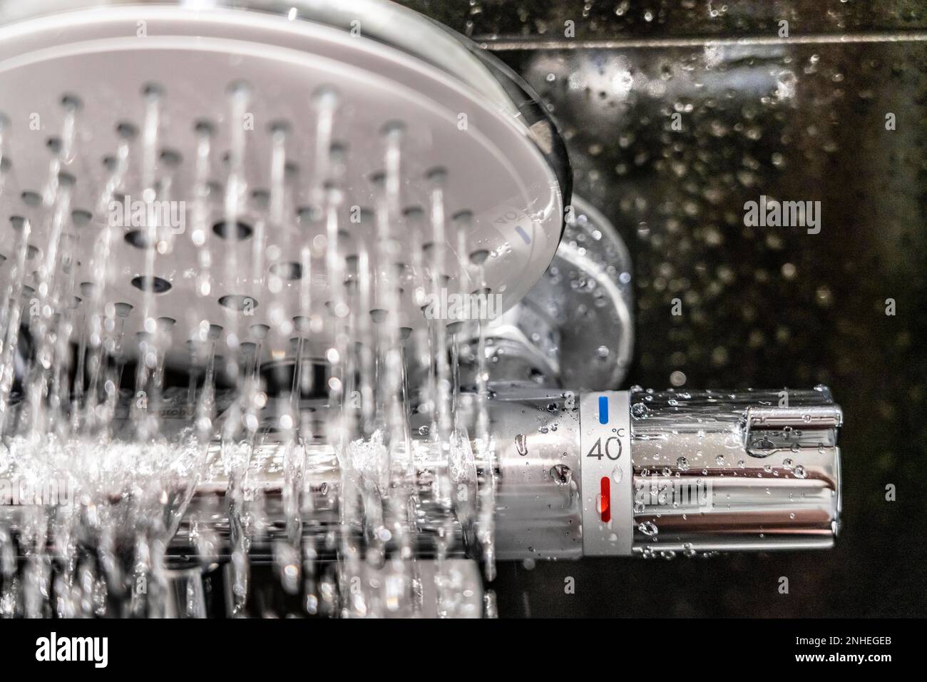 Shower, fitting, temperature control, temperature control of the shower