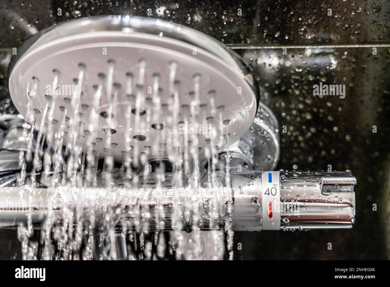 Shower, fitting, temperature control, temperature control of the shower