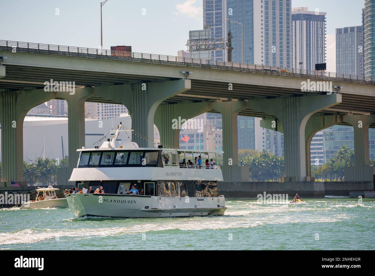 Miami, FL, USA - February 19, 2023: Miami Island Queen tour boat with view of bridge and Downtown Miami in background Stock Photo