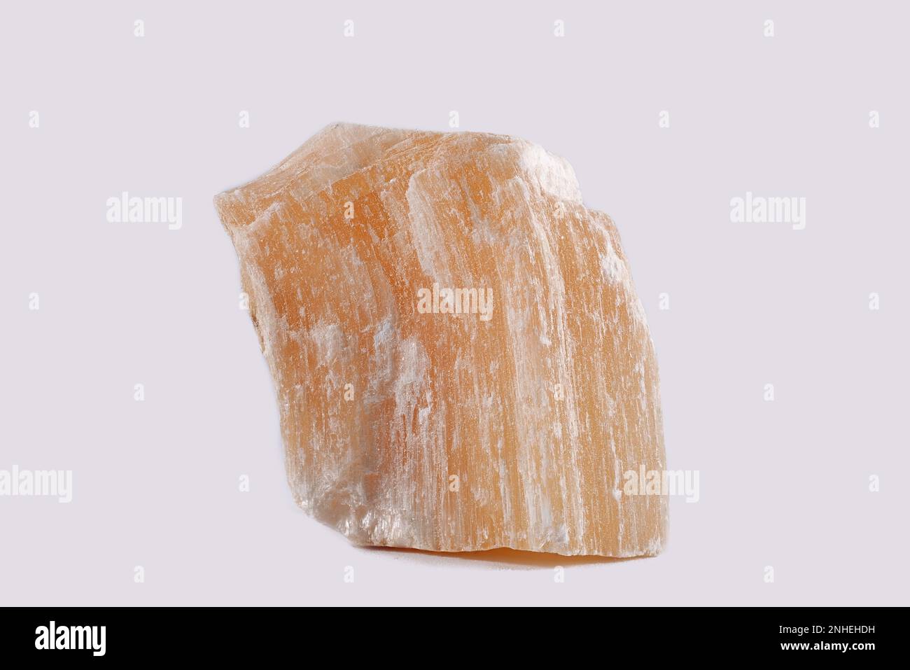 Gypsum is a soft sulfate mineral composed of calcium sulfate dihydrate. It is widely mined and used as a fertilizer. Stock Photo