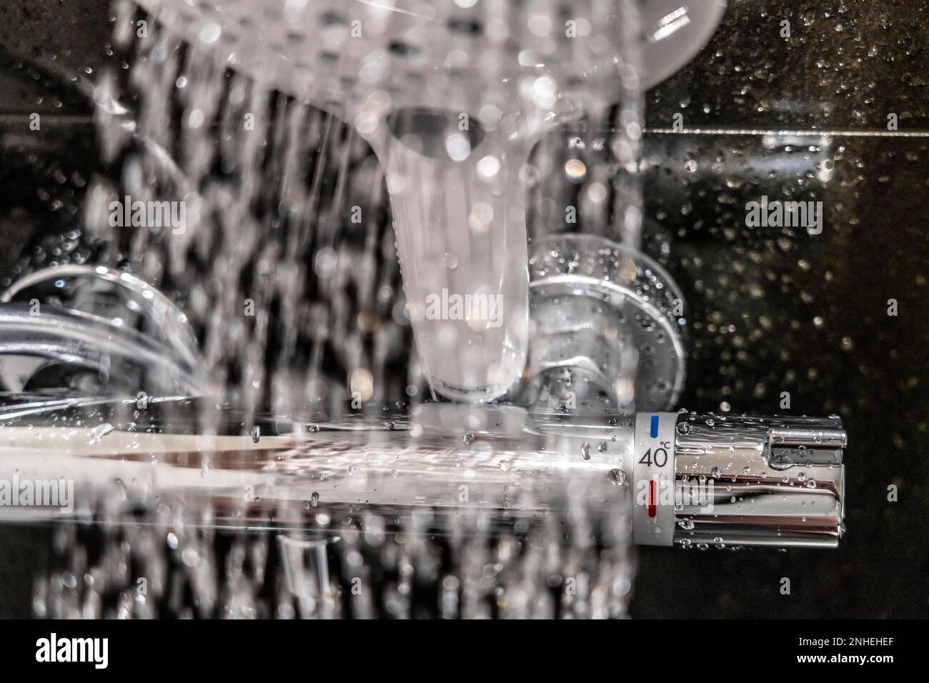 Shower, fitting, temperature control, temperature control of the shower