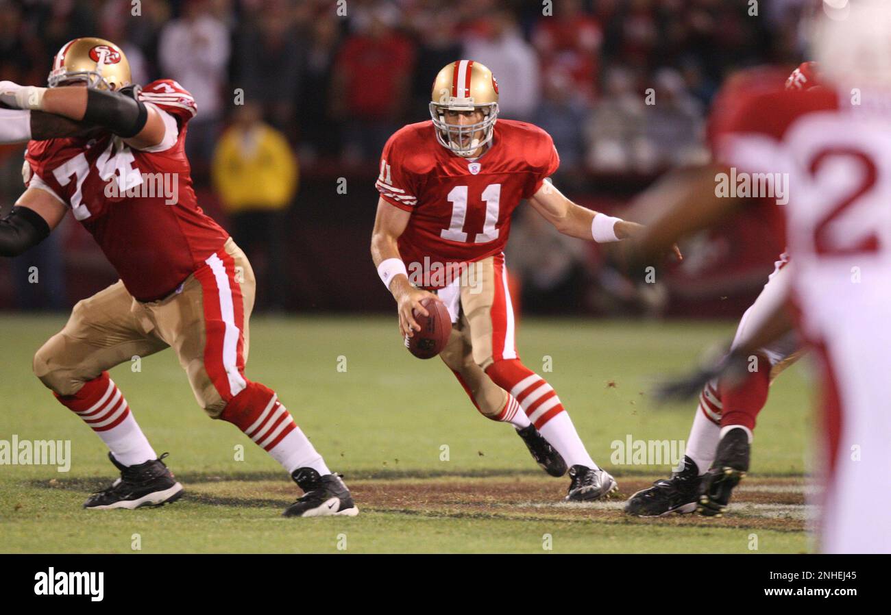 San Francisco Forty Niners quarterback Tim Rattay feels the pressure of St.  Louis Rams Damione Lewis, #92 and Leonard Littlel in the 2nd quarter of  their game at Monster Park in San