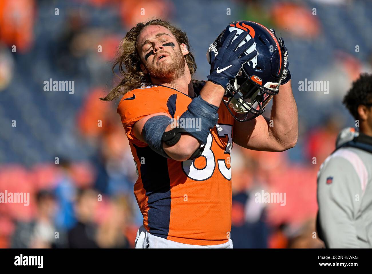 Denver Broncos tight end Andrew Beck (83) warms up before playing
