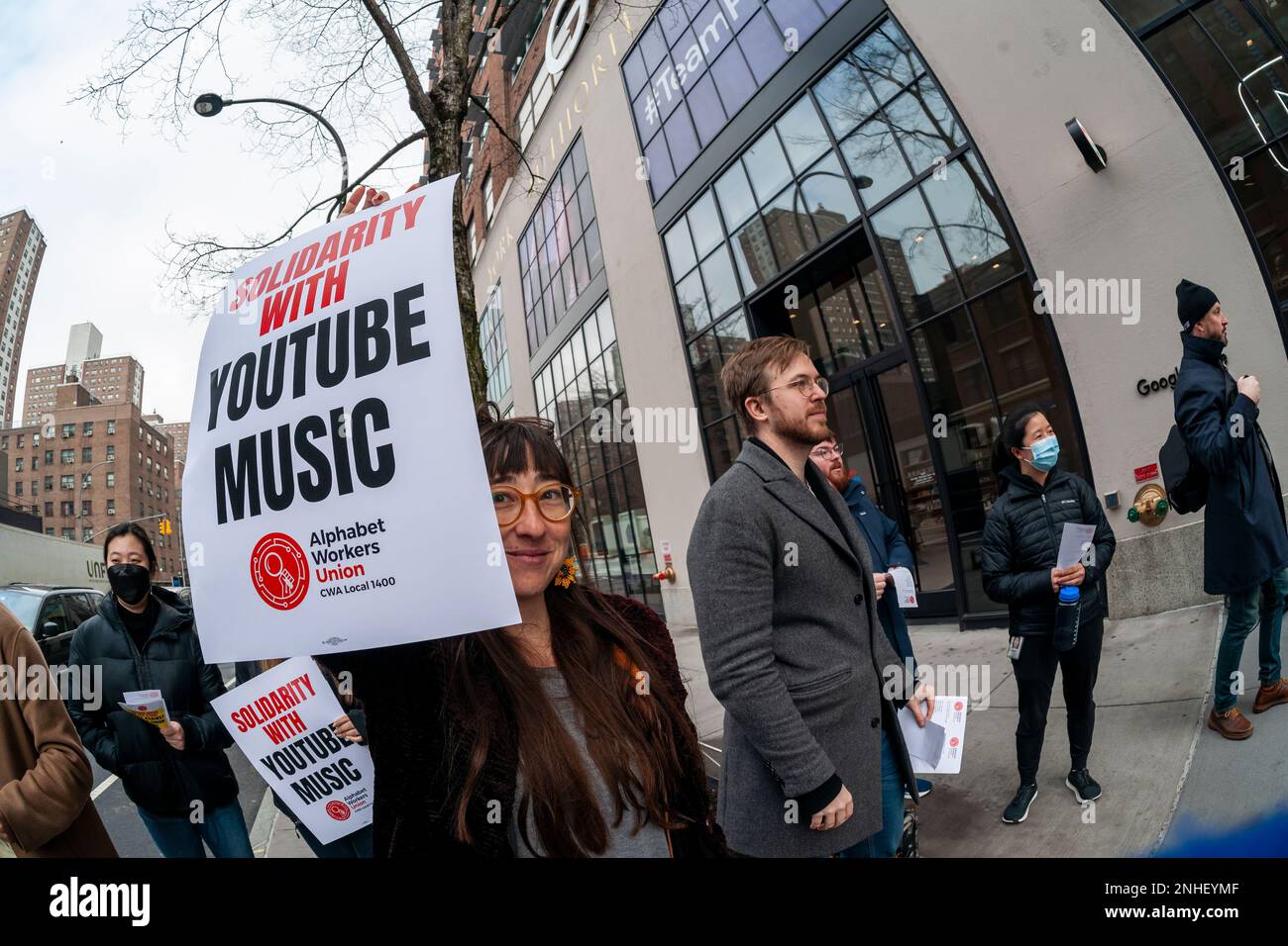YouTube workers and supporters rally outside of the Google building in Chelsea in New York on Tuesday, February 21, 2023 in support of striking YouTube Music workers. The YouTube Music Content Operations team, formally employed by a third-party Cognizant, filed for a union election in the Alphabet Workers Union and claim that they were retaliated against, including a back-to-office mandate. (© Richard B. Levine) Stock Photo
