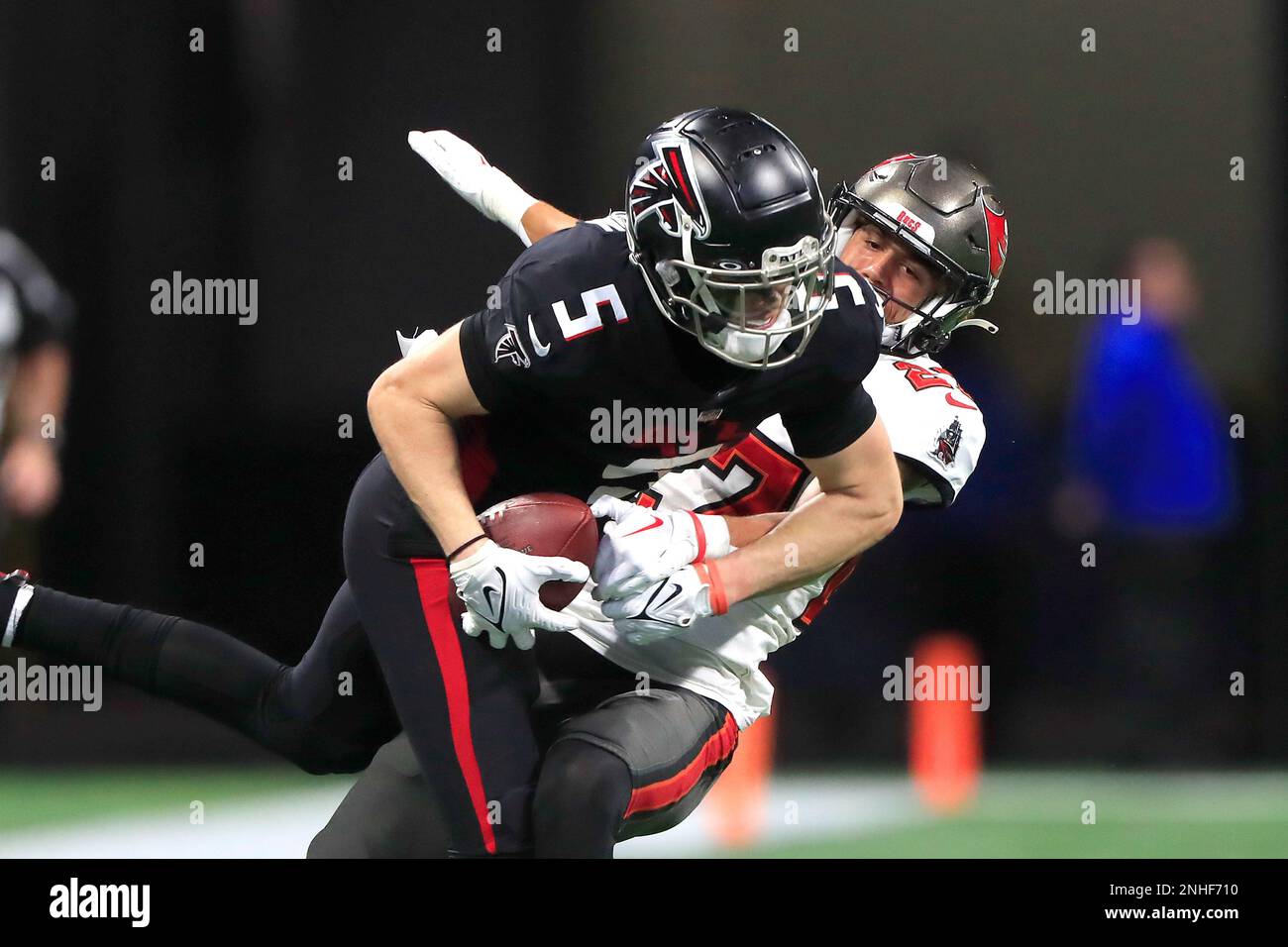 ATLANTA, GA - JANUARY 08: Atlanta Falcons rookie wide receiver Drake London  (5) catches a pass over Tampa Bay Buccaneers cornerback Zyon McCollum (27)  during the Sunday afternoon NFL game between the