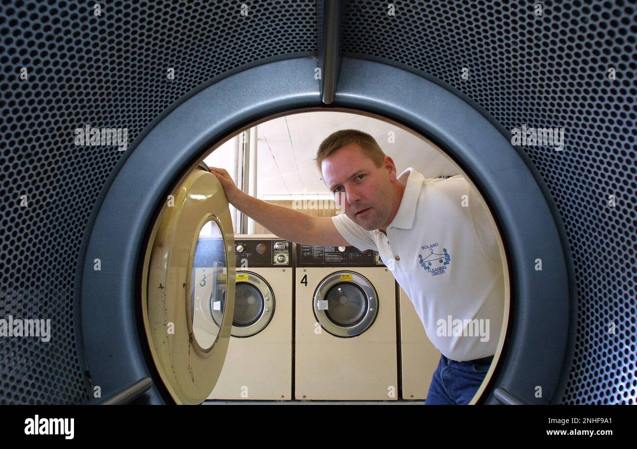 IMPACT27A-C-26MAR01-BU-MAC Solano Cleaning Center in Albany, owner Harry  Pruyn seen through one of his many dryers, has an energy bill of $5,672.00  for the month of February. Gas and electricity for his