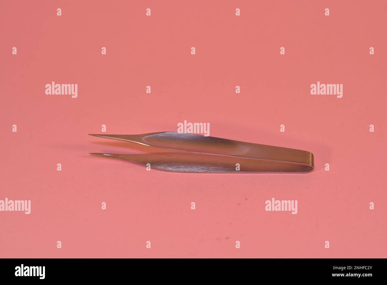First aid kit tweezers on a pink background medical Stock Photo Alamy