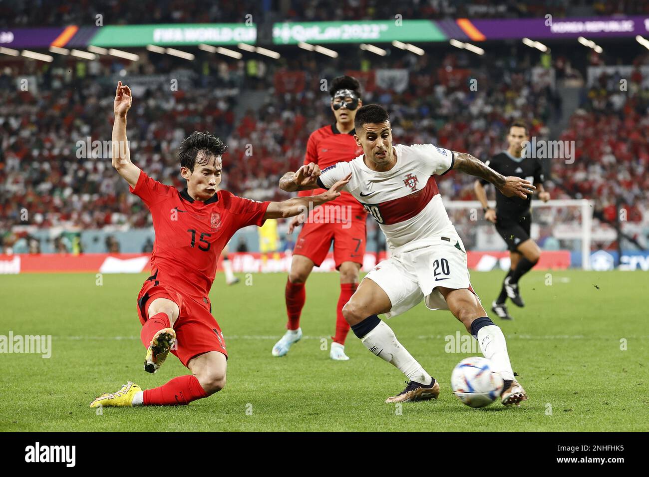 DOHA - (l-r) Moon-hwan Kim of Korea Republic, Joao Cancelo of Portugal during the FIFA World Cup Qatar 2022 group H match between South Korea and Portugal at Education City Stadium on December 2, 2022 in Doha, Qatar. AP | Dutch Height | MAURICE OF STONE Stock Photo